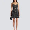 Abito in tweed con spalline a catena Abito in tweed con spalline a catena