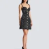 Abito in tweed con spalline a catena Abito in tweed con spalline a catena