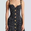 Abito in tweed con spalline a catena Abito in tweed con spalline a catena