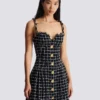 Abito in tweed con spalline a catena Abito in tweed con spalline a catena