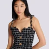 Abito in tweed con spalline a catena Abito in tweed con spalline a catena