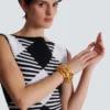 Bracciale rigido con catena in ottone