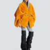 Cappotto in shearling con cintura Cappotto in shearling con cintura
