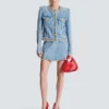 Giacca in denim con rifiniture in perle Giacca in denim con rifiniture in perle