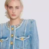 Giacca in denim con rifiniture in perle Giacca in denim con rifiniture in perle