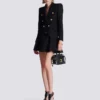 Giacca in tweed con 6 bottoni Giacca in tweed con 6 bottoni