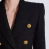 Giacca in tweed con 6 bottoni Giacca in tweed con 6 bottoni
