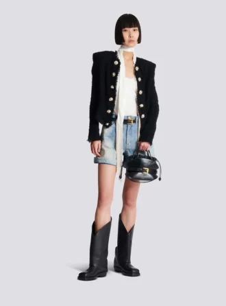 Giacca in tweed con bordi a filo Giacca in tweed con bordi a filo