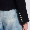 Giacca in tweed con bordi a filo Giacca in tweed con bordi a filo