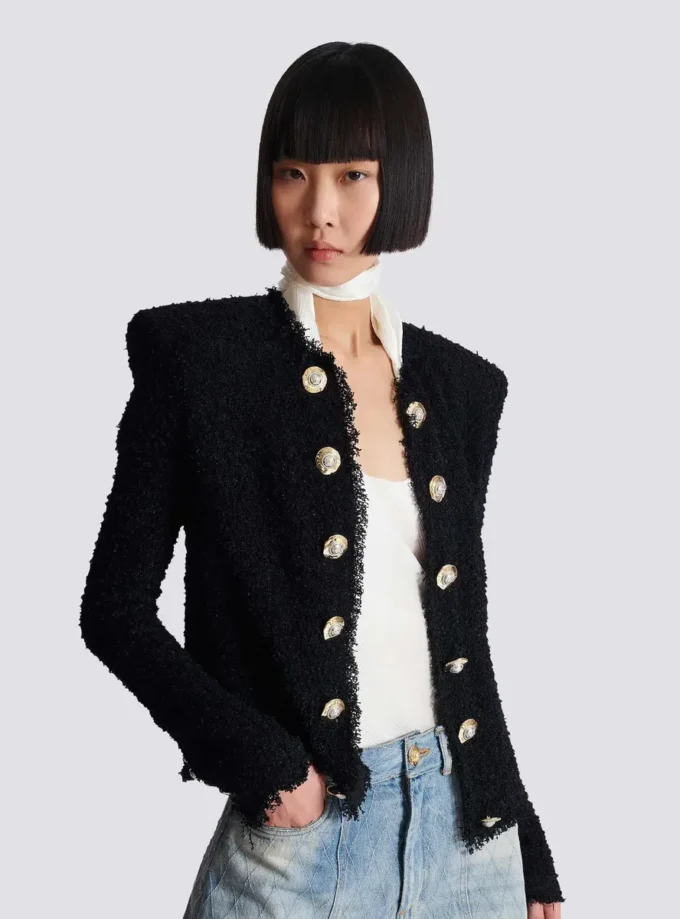 Giacca in tweed con bordi a filo Giacca in tweed con bordi a filo