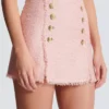 Gonna corta in tweed con paillettes Gonna corta in tweed con paillettes