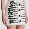 Gonna in tweed con ricamo a forma di lettera d’amore Gonna in tweed con ricamo a forma di lettera d’amore