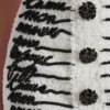 Gonna in tweed con ricamo a forma di lettera d’amore Gonna in tweed con ricamo a forma di lettera d’amore