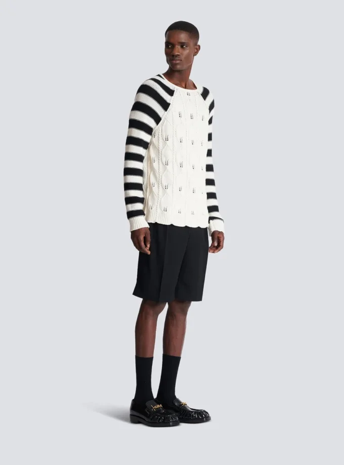 Maglione lavorato a trecce Maglione lavorato a trecce