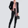 Pantaloni a vita alta con motivo grain de poudre Pantaloni a vita alta con motivo grain de poudre