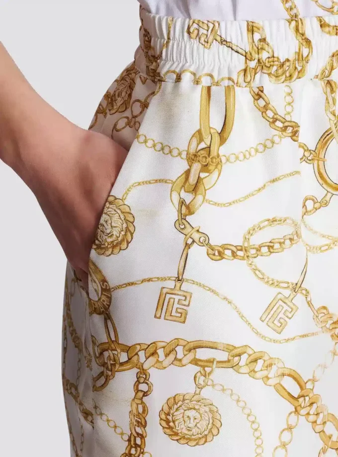 Pantaloni fluidi in seta stampata con motivo Balmain Chains Pantaloni fluidi in seta stampata con motivo Balmain Chains