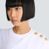 T-shirt drappeggiata con bottoni T-shirt drappeggiata con bottoni